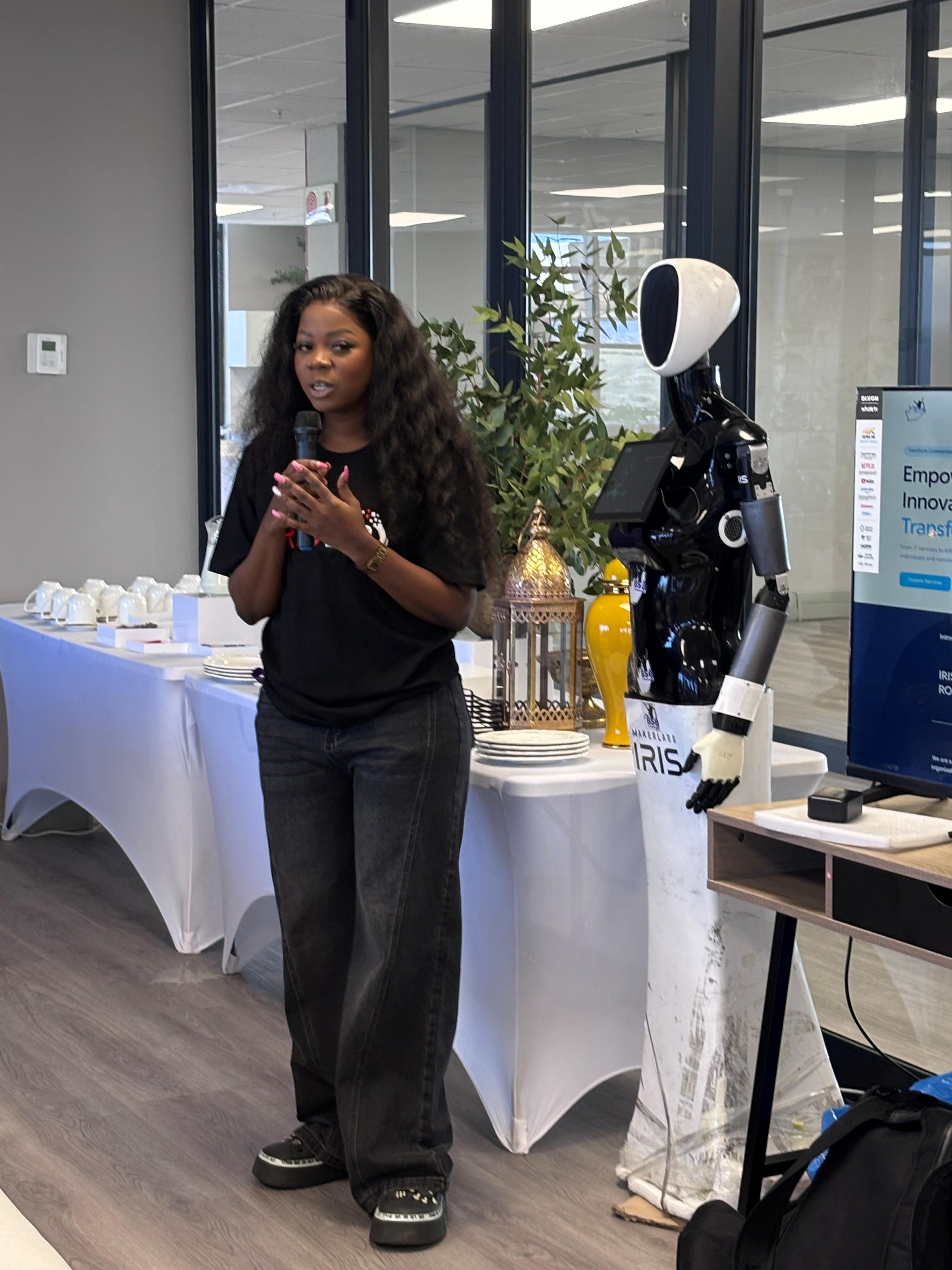 BSG Technologies founder and CEO Ms Thando Gumede addresses attendees at the IRIS Showroom launch alongside the IRIS AI Humanoid robot